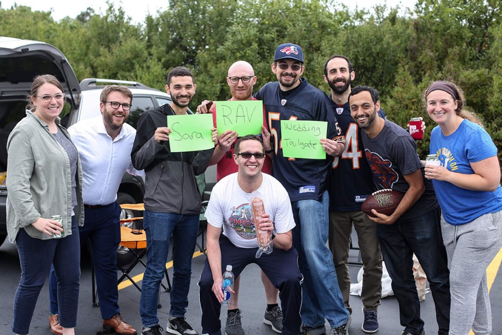 The couple opted for a unique and fun way to kick off their wedding celebration: a tailgate party, complete with grilled kosher meat, drinks and football. 